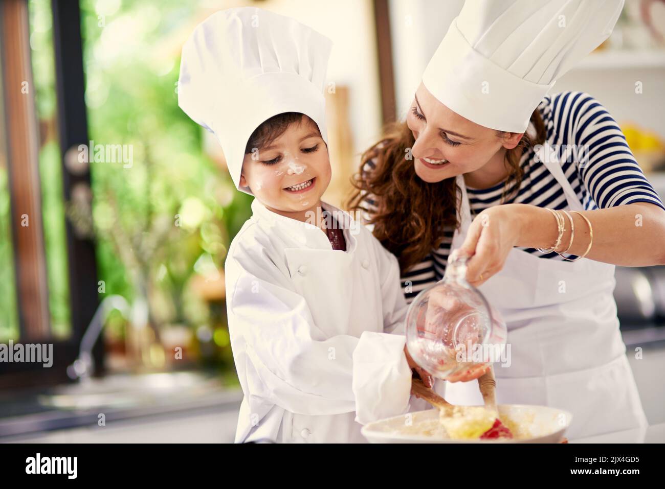Baking is love made edible. a mother and her son baking in the kitchen