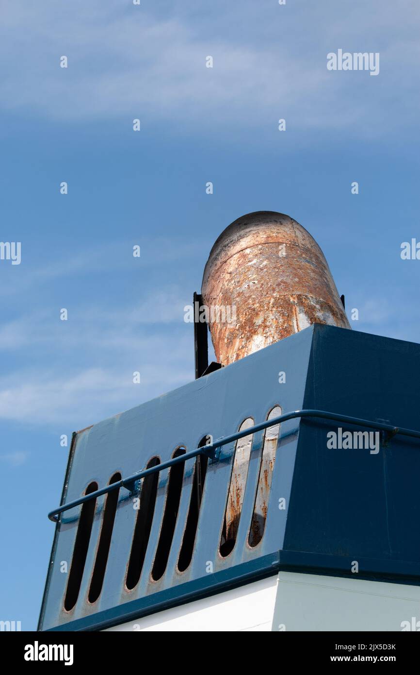 Blue exhaust funnel on a ship Stock Photo