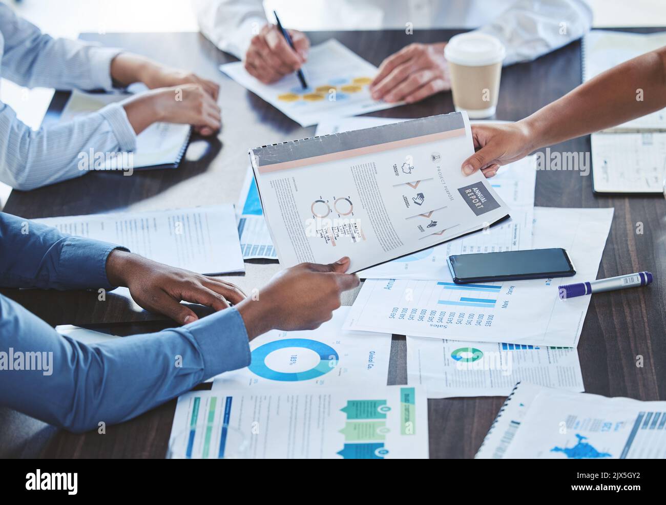 Teamwork hands, paperwork and planning annual report data, research and