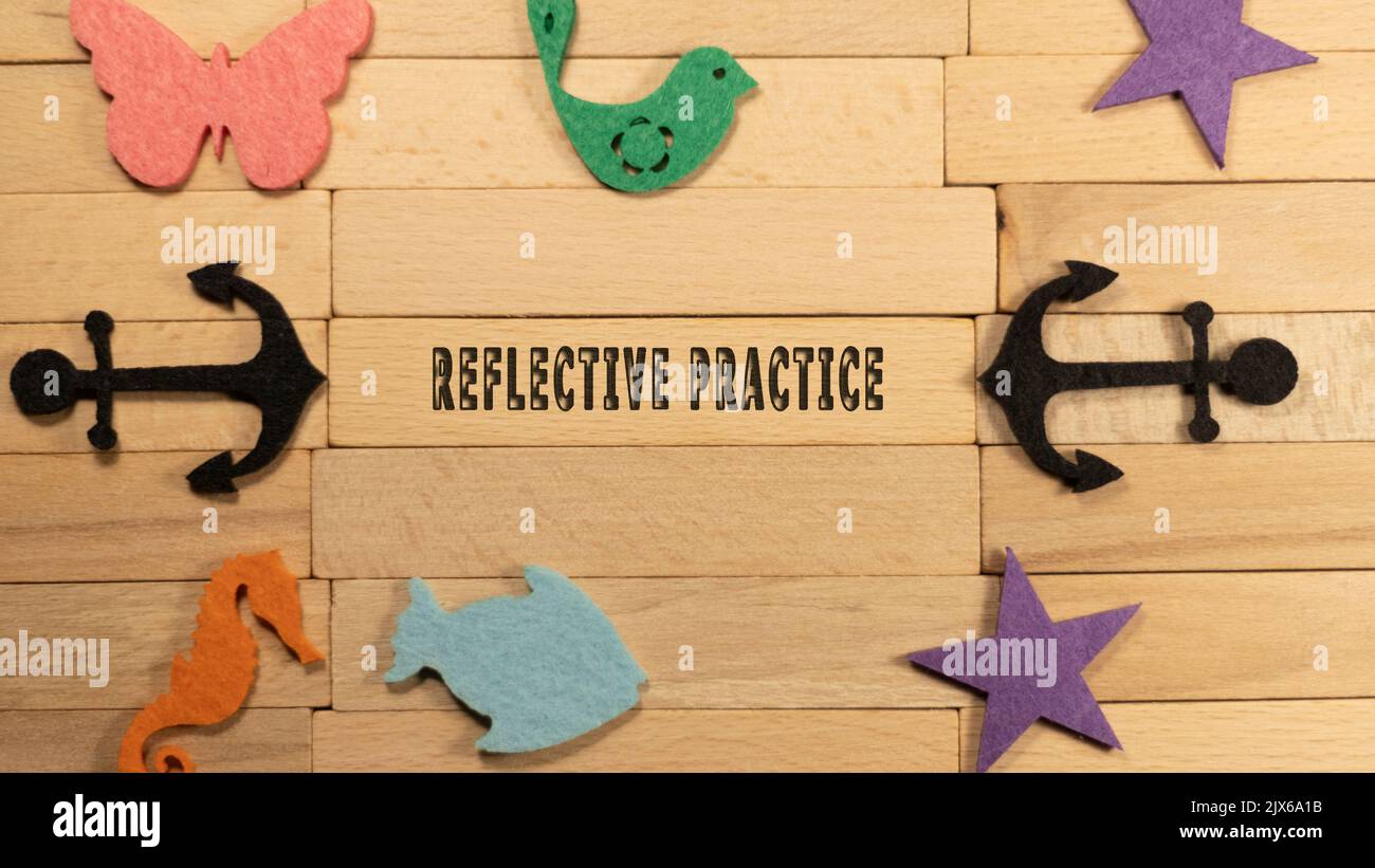 Reflective practise plan written on wooden surface. Education and child development Stock Photo