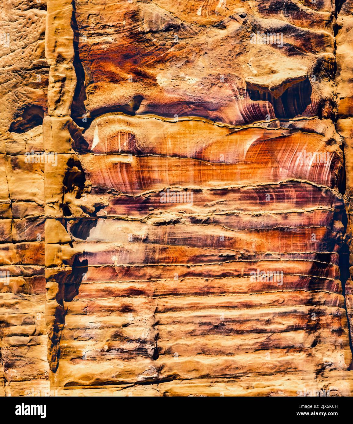 Colorful Rock Tombs Morning Street of Facades Petra Jordan Built by Nabataens in 200 BC to 400 AD Tombs have many abstracts close up Magnesium in rock Stock Photo