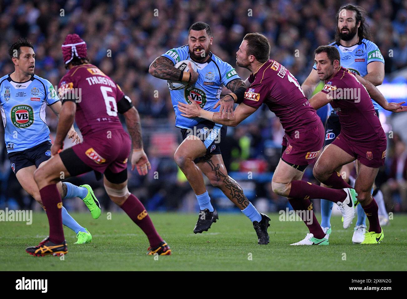 Andrew Fifita Of The Blues Is Tackled By Gavin Cooper Of The Maroons ...