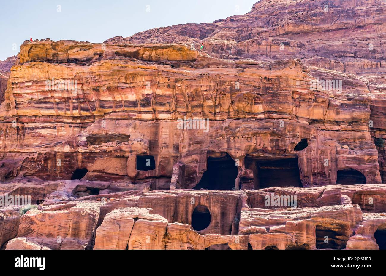 Rose Red Rock Tombs Morning Street of Facades Petra Jordan Built by Nabataens in 200 BC to 400 AD Canyon walls change Rose Red afternoon when sun goes Stock Photo