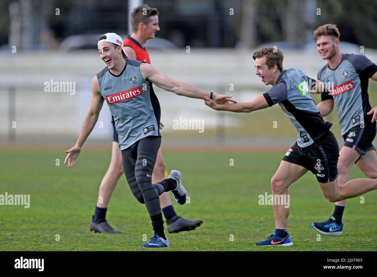 Collingwood AFL star Jackson Ramsay (centre) celebrates during a soccer ...