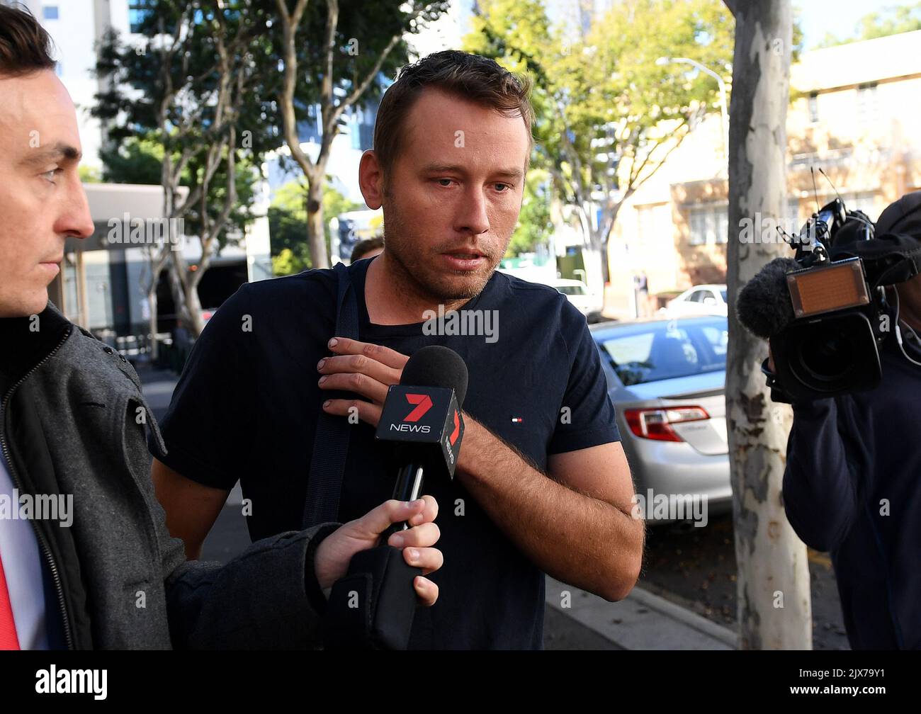 Daniel Allan Baker leaves the Magistrates Court in Brisbane, Thursday ...