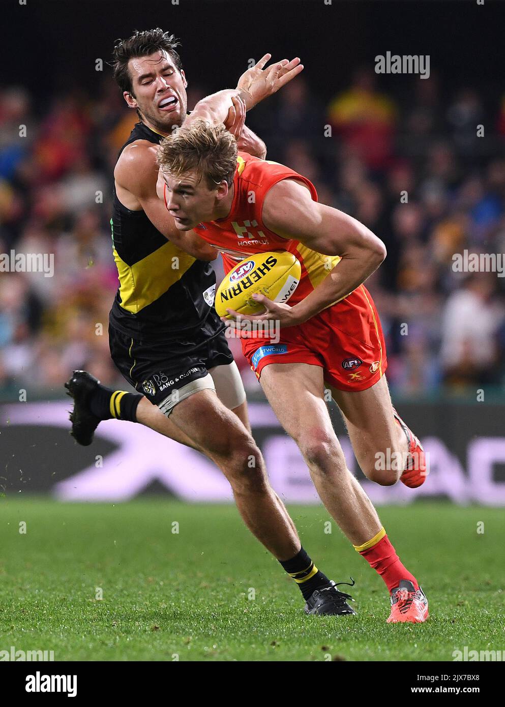 Suns player Tom Lynch (right) competes with Tigers player Alex Rance ...