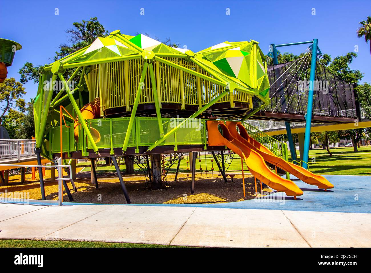 Modern Children's Playground Equipment At Free Public Park Stock Photo