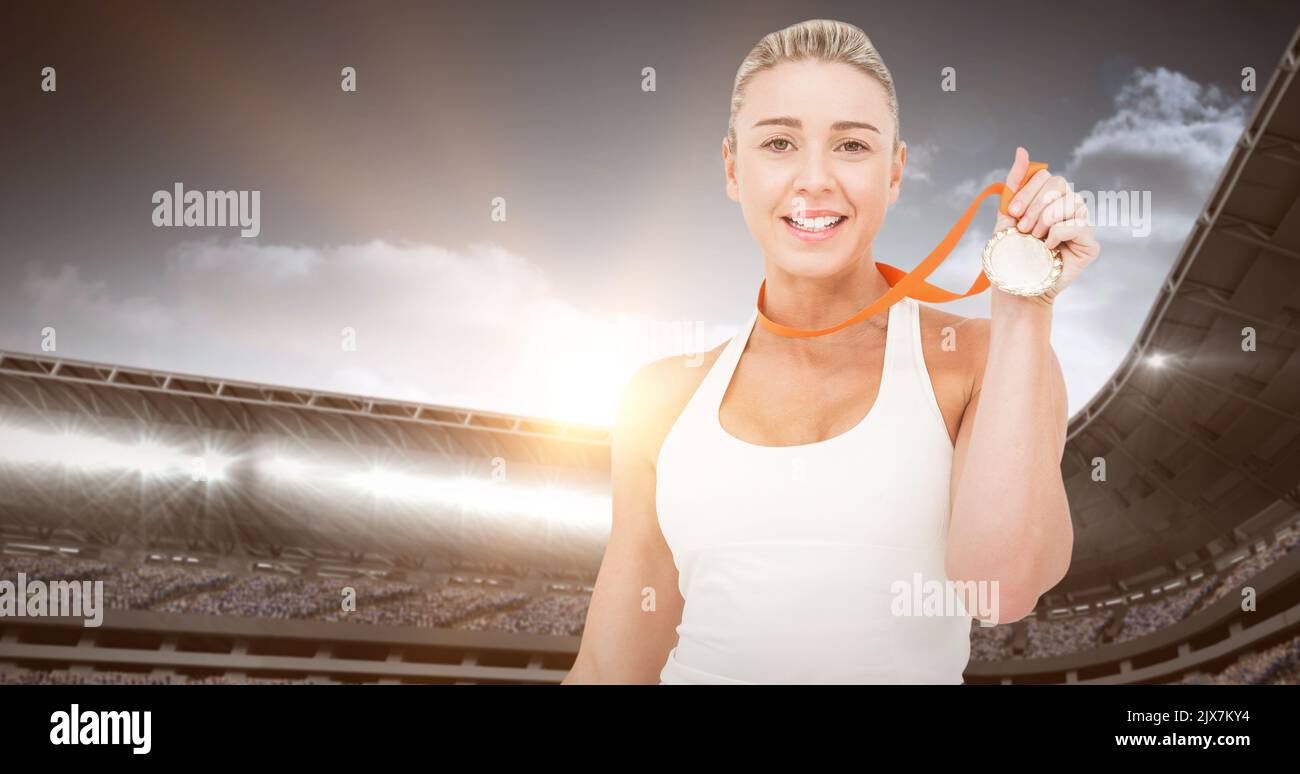 Professional sportsperson sports venue holding smiling achievement