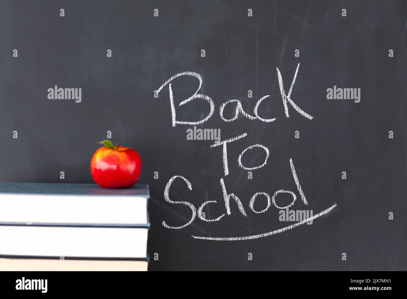 Back to school message on chalkboard Stock Photo - Alamy