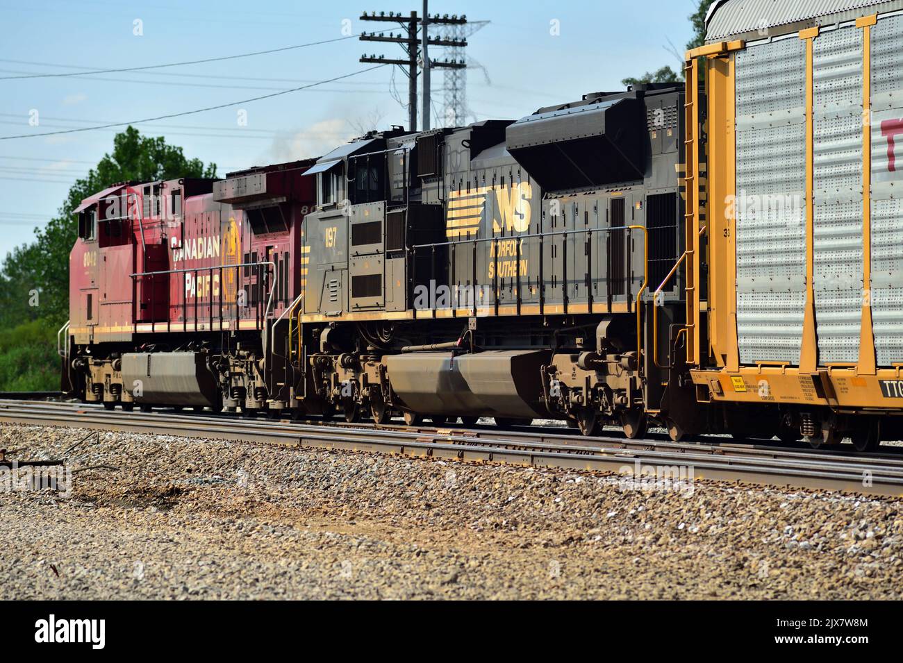 Bartlett, Illinois, USA. A pair of locomotives, including a run-through Norfolk Southern Railway unit lead a Canadian Pacific Railway freight train. Stock Photo