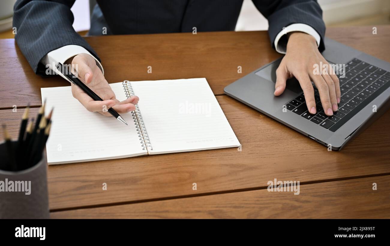 Above view, A smart Asian businessman or male manager in formal suit ...