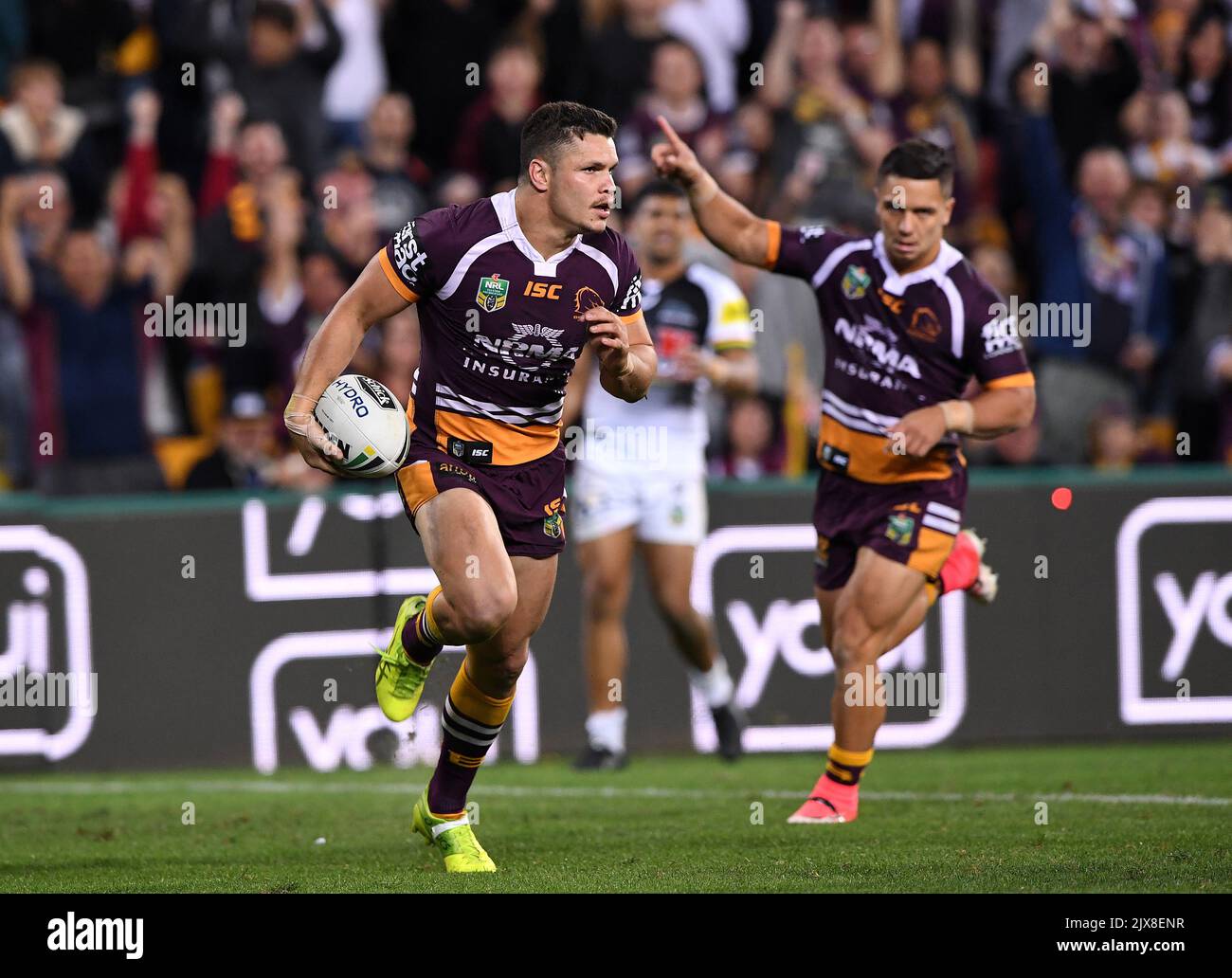 Broncos player Kodi Nikorima (right) reacts as James Roberts crosses