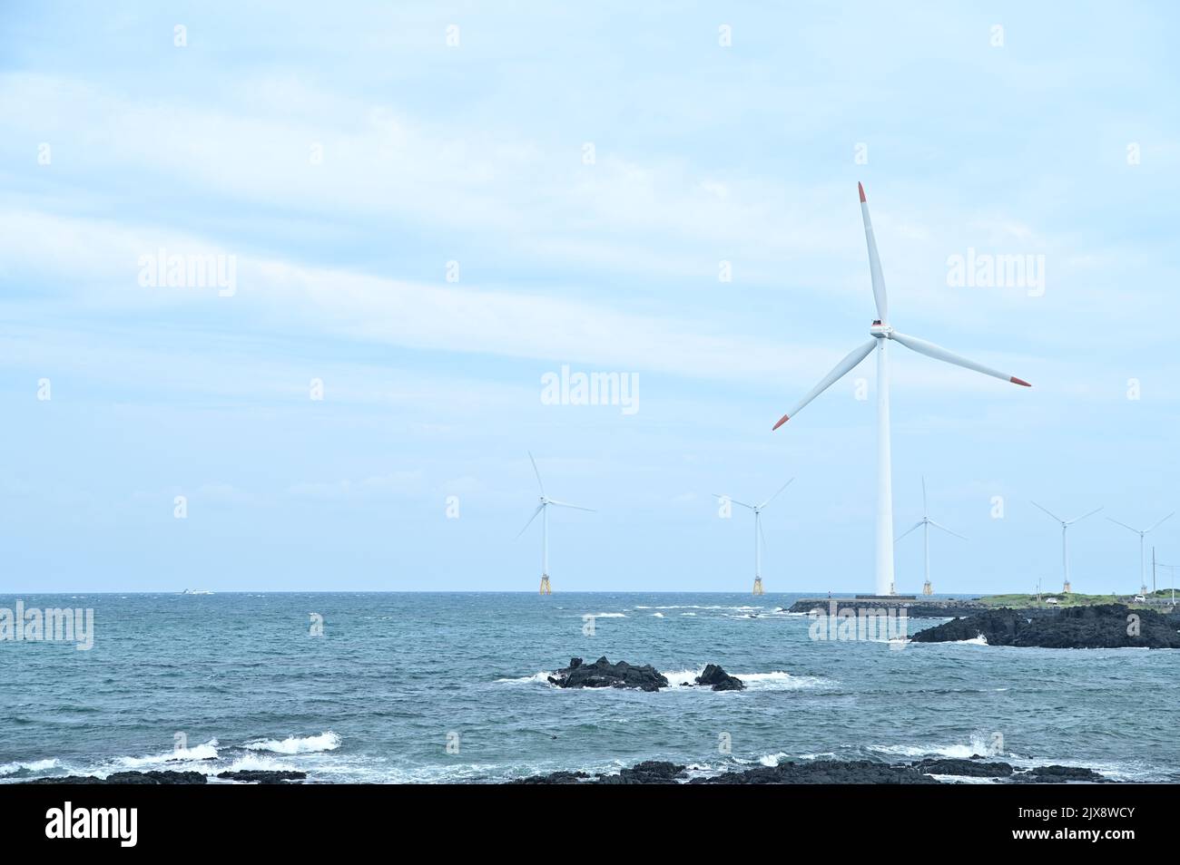 Wind turbines are built in the sea Stock Photo
