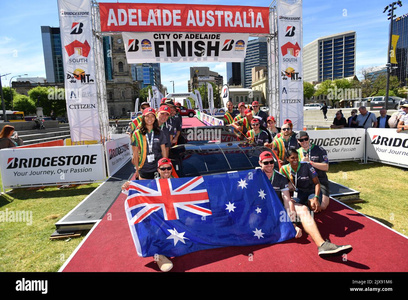 Clenergy Team Arrow Solar car team celebrates after crossing the finish ...
