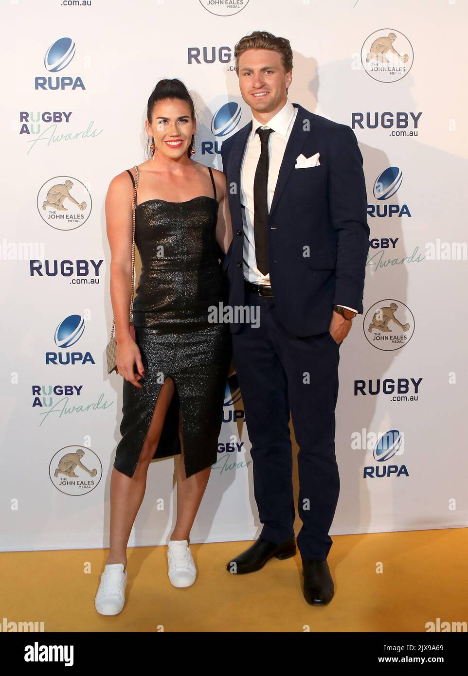 Rugby Sevens player Charlotte Caslick and her partner Lewis Holland pose  for a photograph at the 