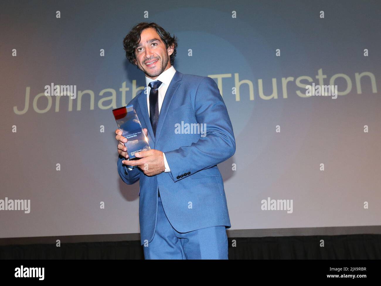 Queensland Australian of the Year winner NRL player Jonathan Thurston poses with his award at
