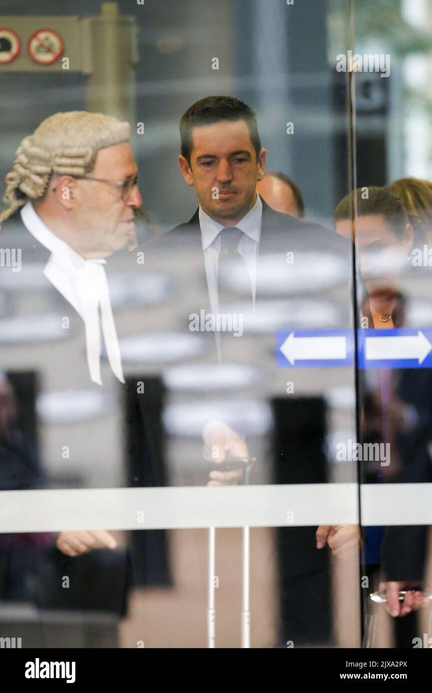 Former soldier Christopher Carter (centre) leaves the Brisbane Supreme ...