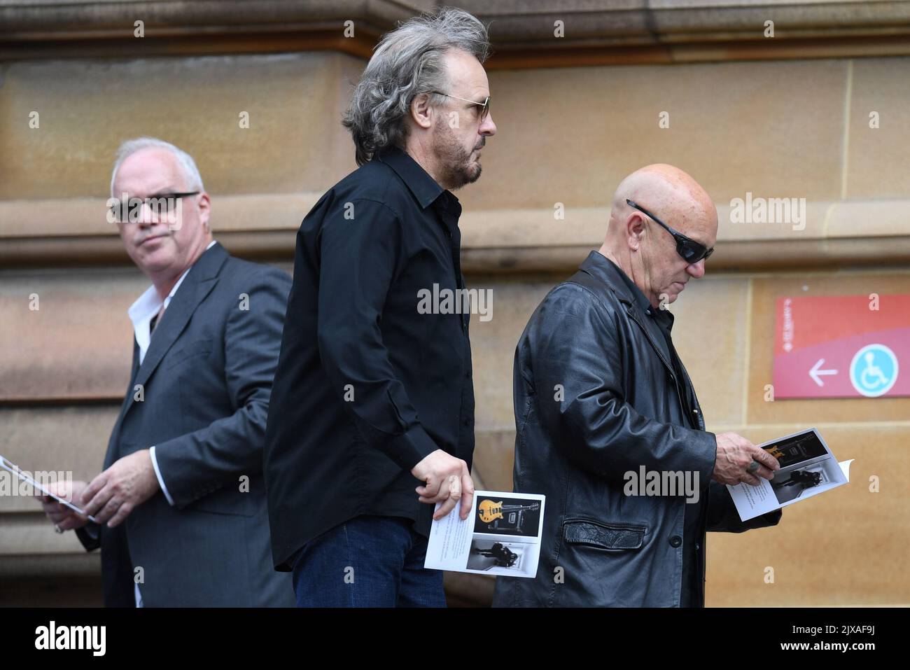Angry Anderson (right) arrives for the funeral of AC/DC co-founder and ...