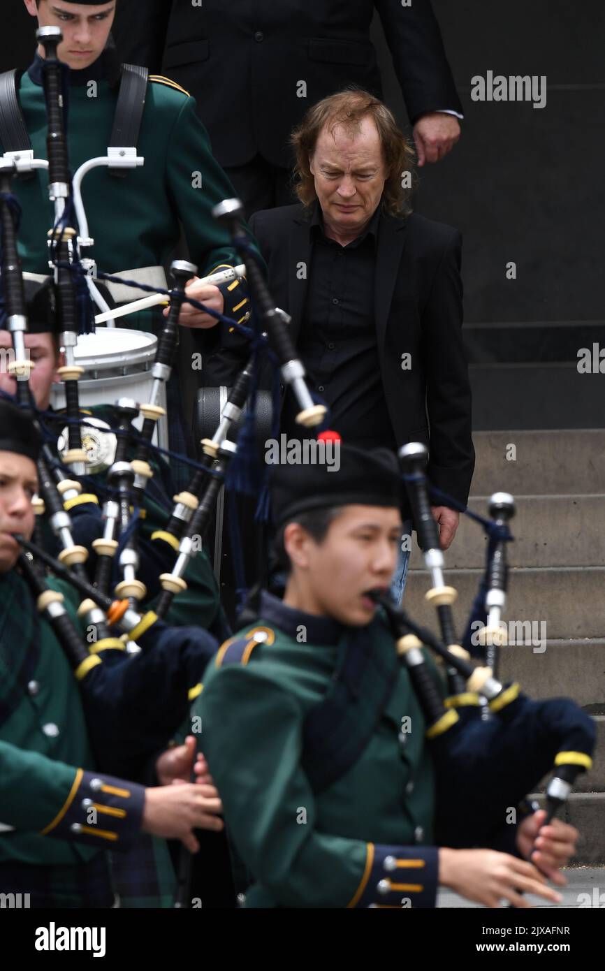 Angus Young leads the casket of his brother AC/DC co-founder and ...