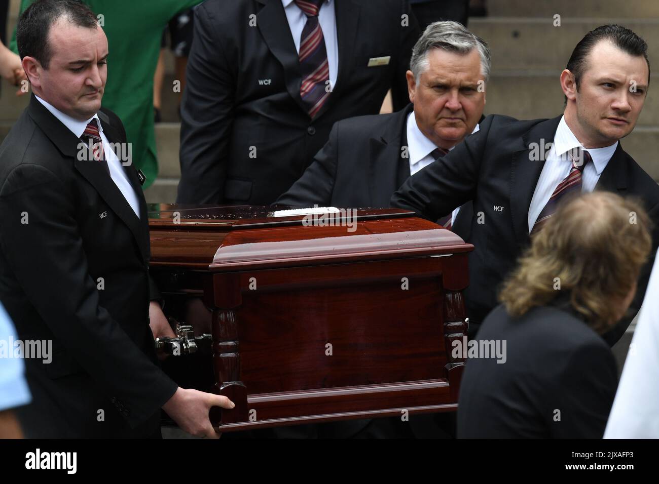 The casket of AC/DC co-founder and guitarist Malcolm Young is carried ...