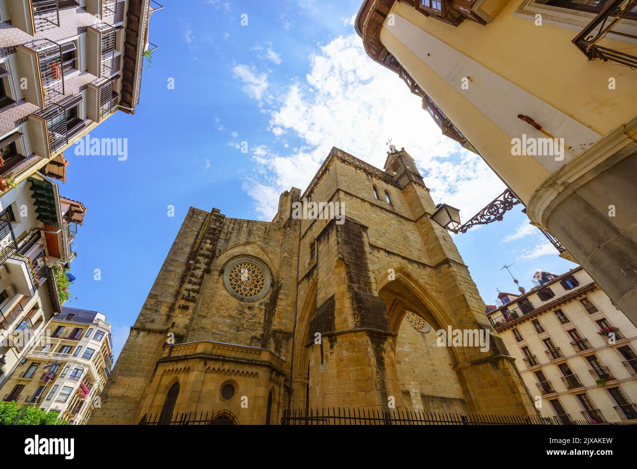 Low angle view of a gothic church against sky in Donostia Spain Stock Photo