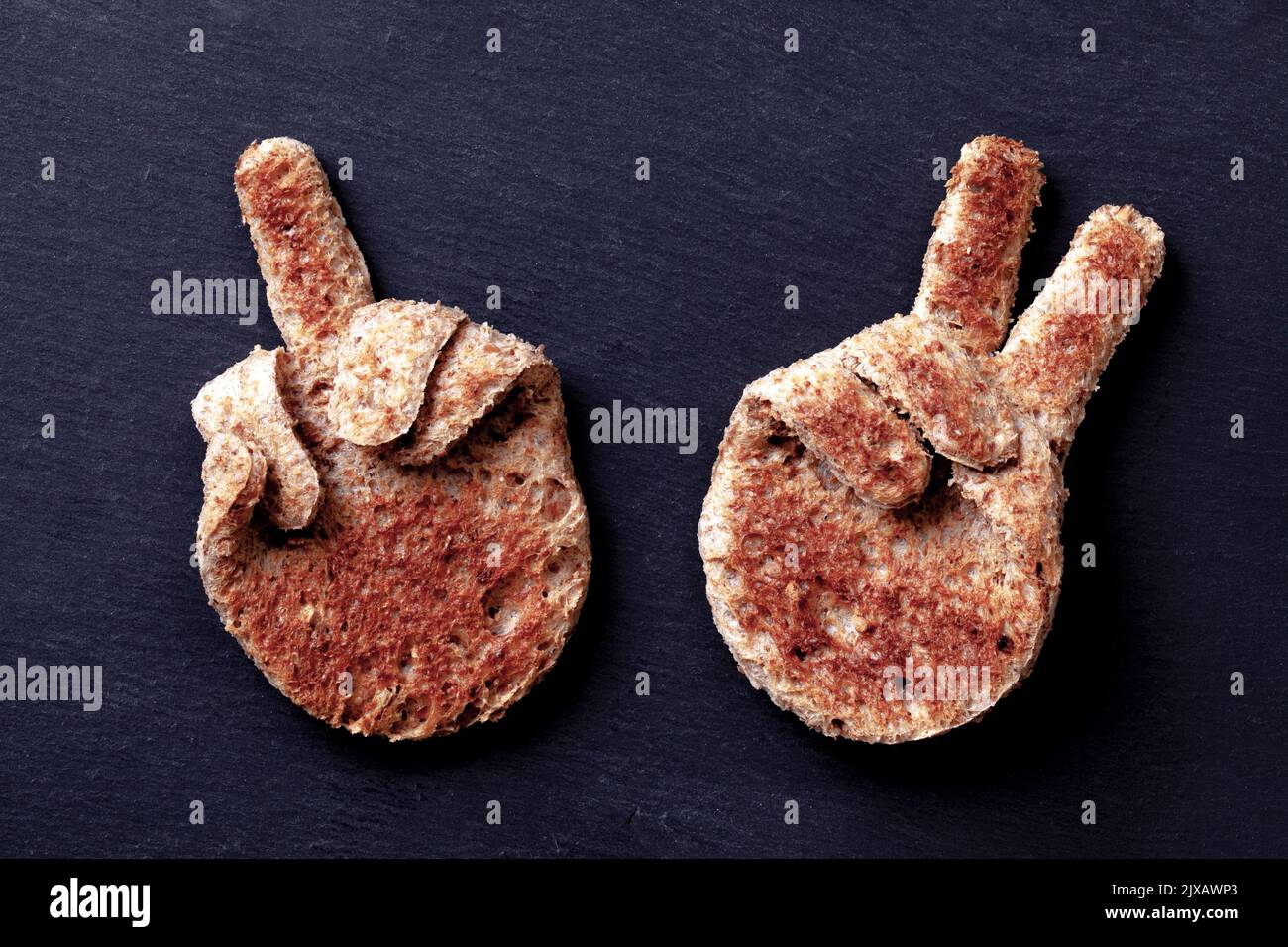 Hand signs made from toased sliced brown bread Stock Photo