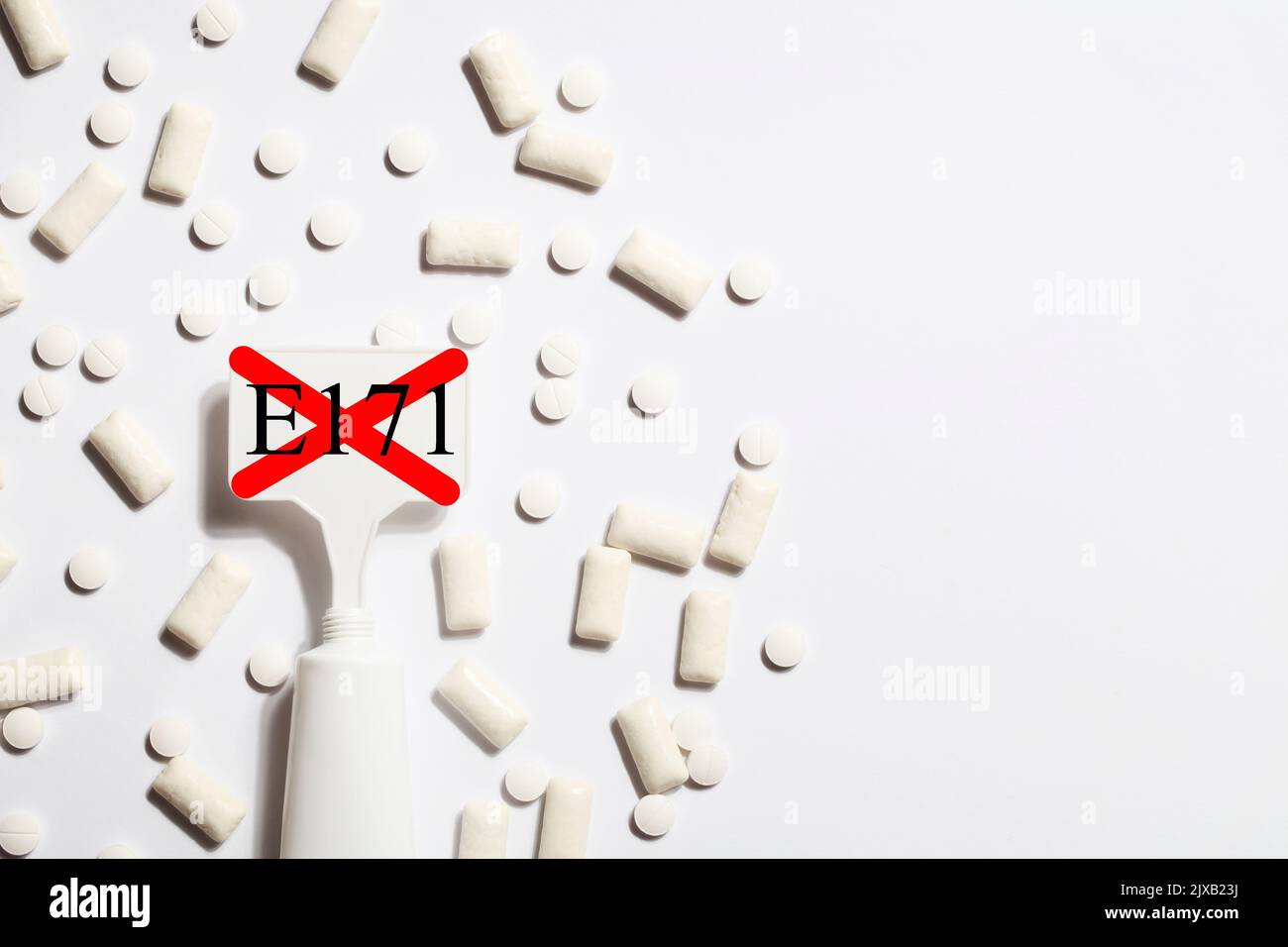 Titanium dioxide, E171, dangerous additive concept. gum, pills