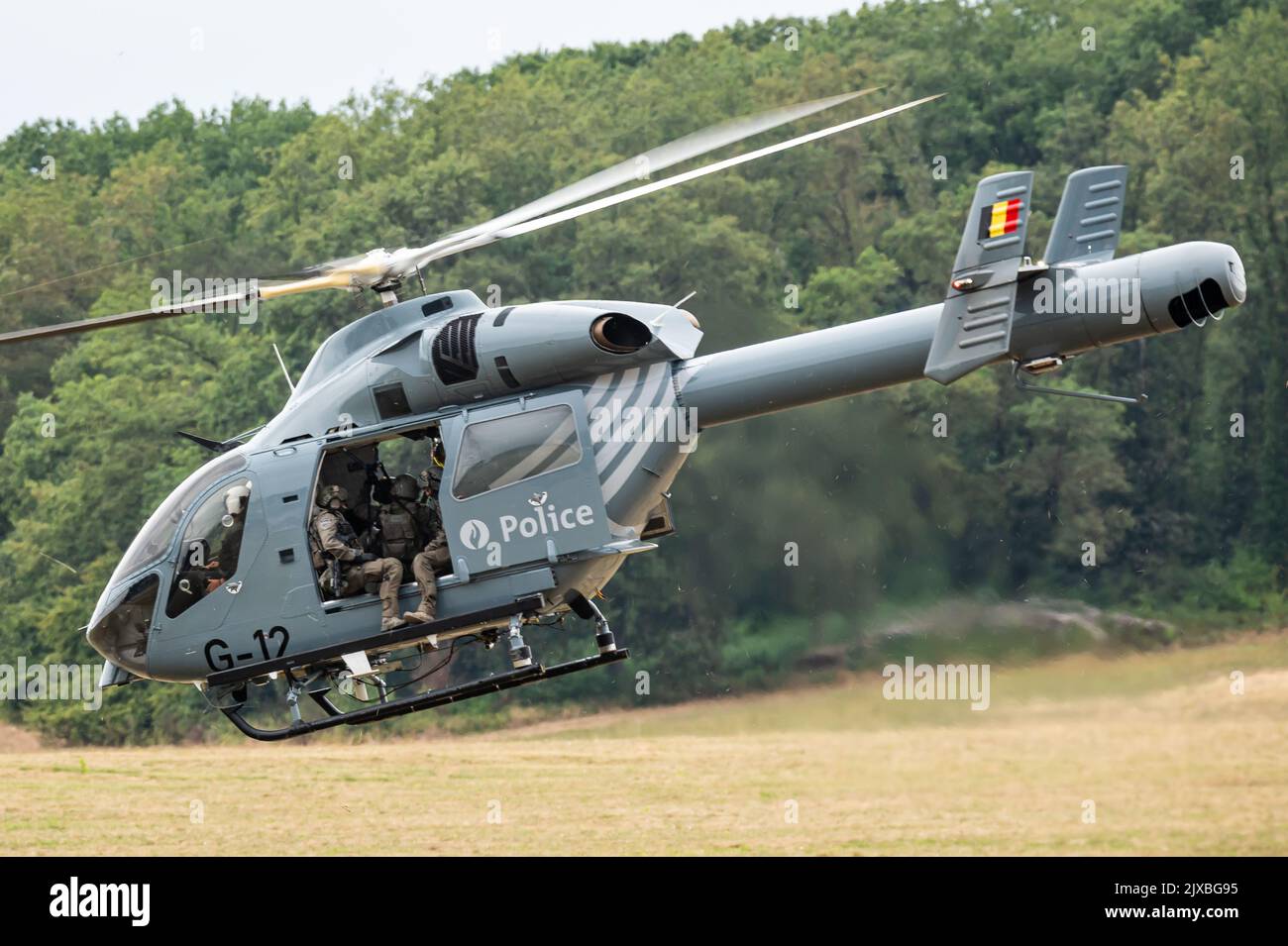 A MD Helicopters MD Explorer 900 helicopter of the Belgian Federal Police with members of the DSU special police forces. Stock Photo