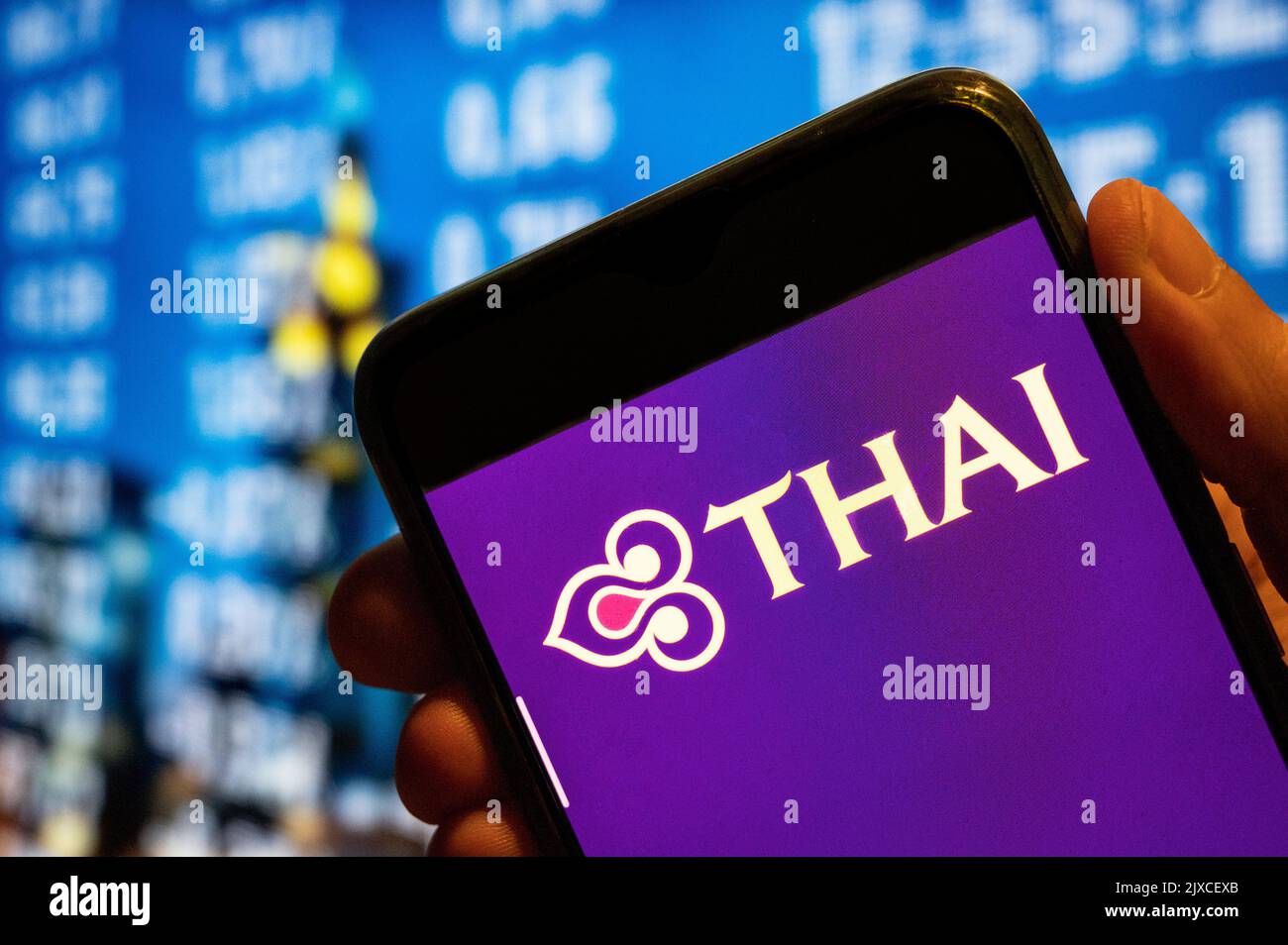 In this photo illustration, the flag carrier airline of Thailand, Thai Airways, logo is displayed on a smartphone screen. Stock Photo