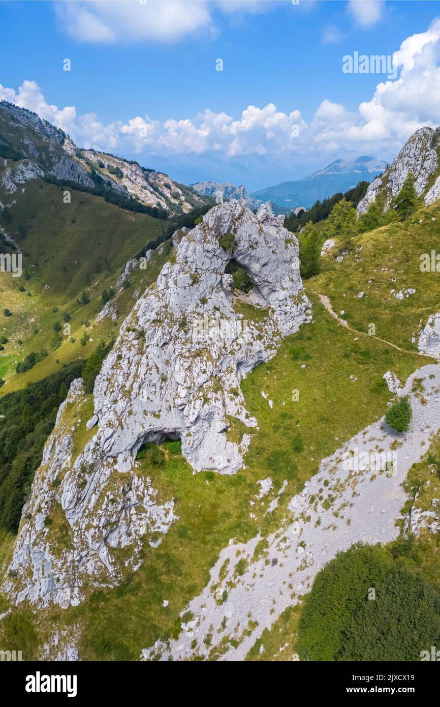 Aerial view of the natural arch rock formation called Porta di Prada in the Grigna mountain. Grigna Settentrionale, Mandello del Lario, Lombardy, Ital Stock Photo