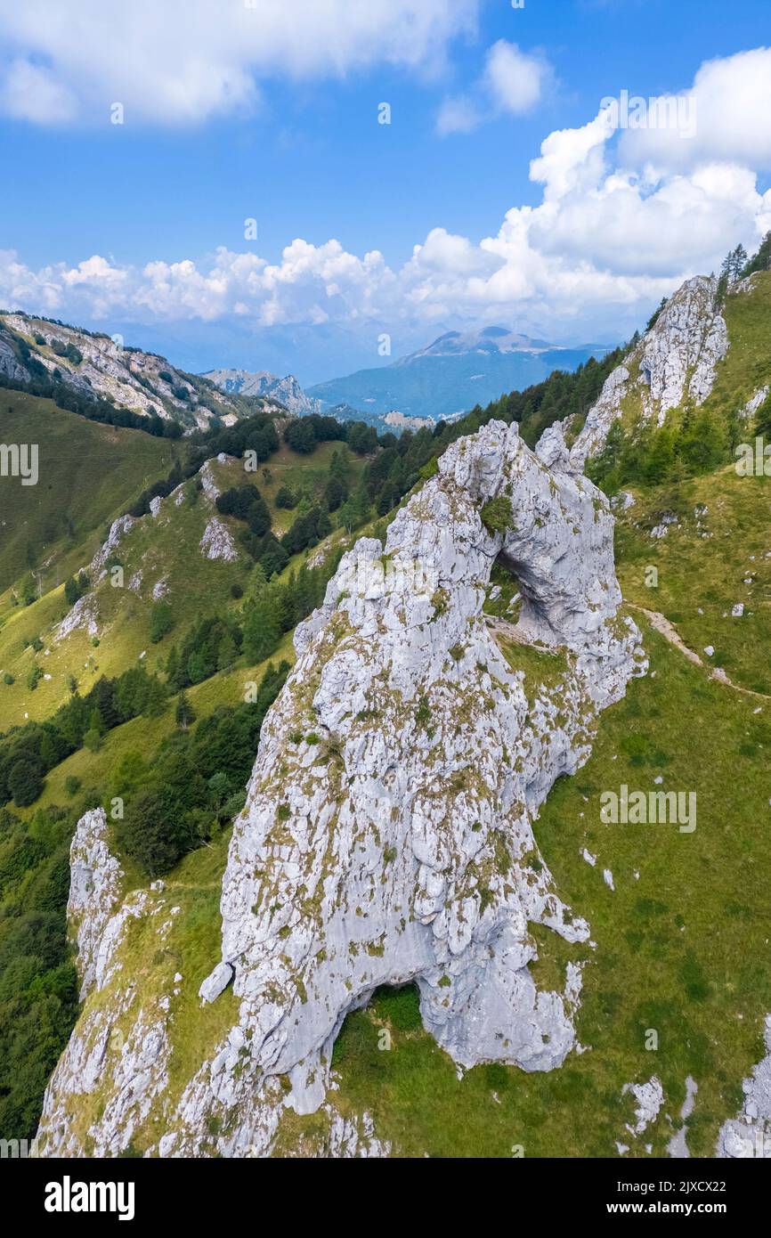 Aerial view of the natural arch rock formation called Porta di Prada in the Grigna mountain. Grigna Settentrionale, Mandello del Lario, Lombardy, Ital Stock Photo