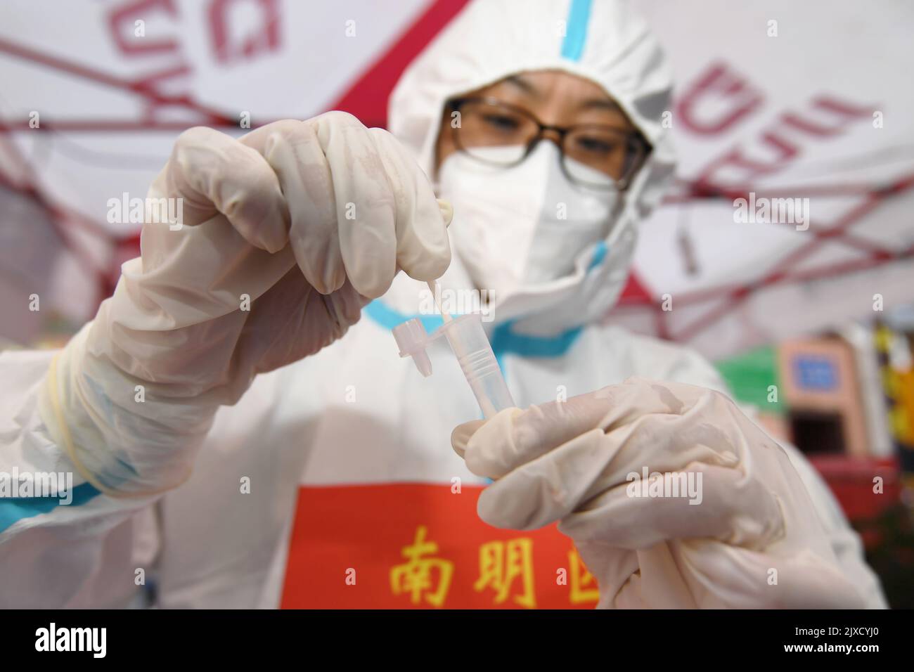 GUIYANG, CHINA - SEPTEMBER 7, 2022 - A staff member performs an antigen ...
