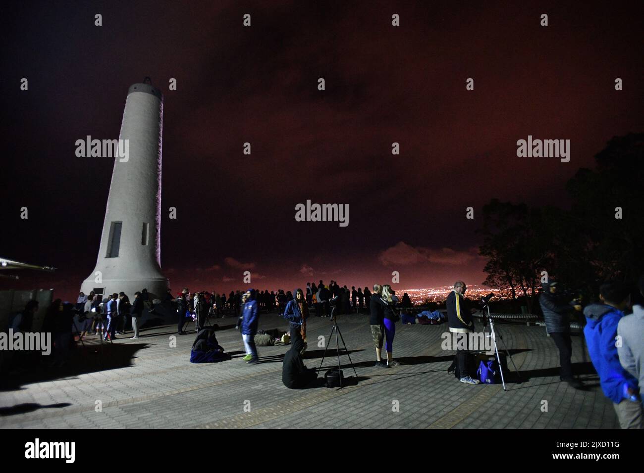 People gather to watch the moon during a super blue blood moon lunar ...