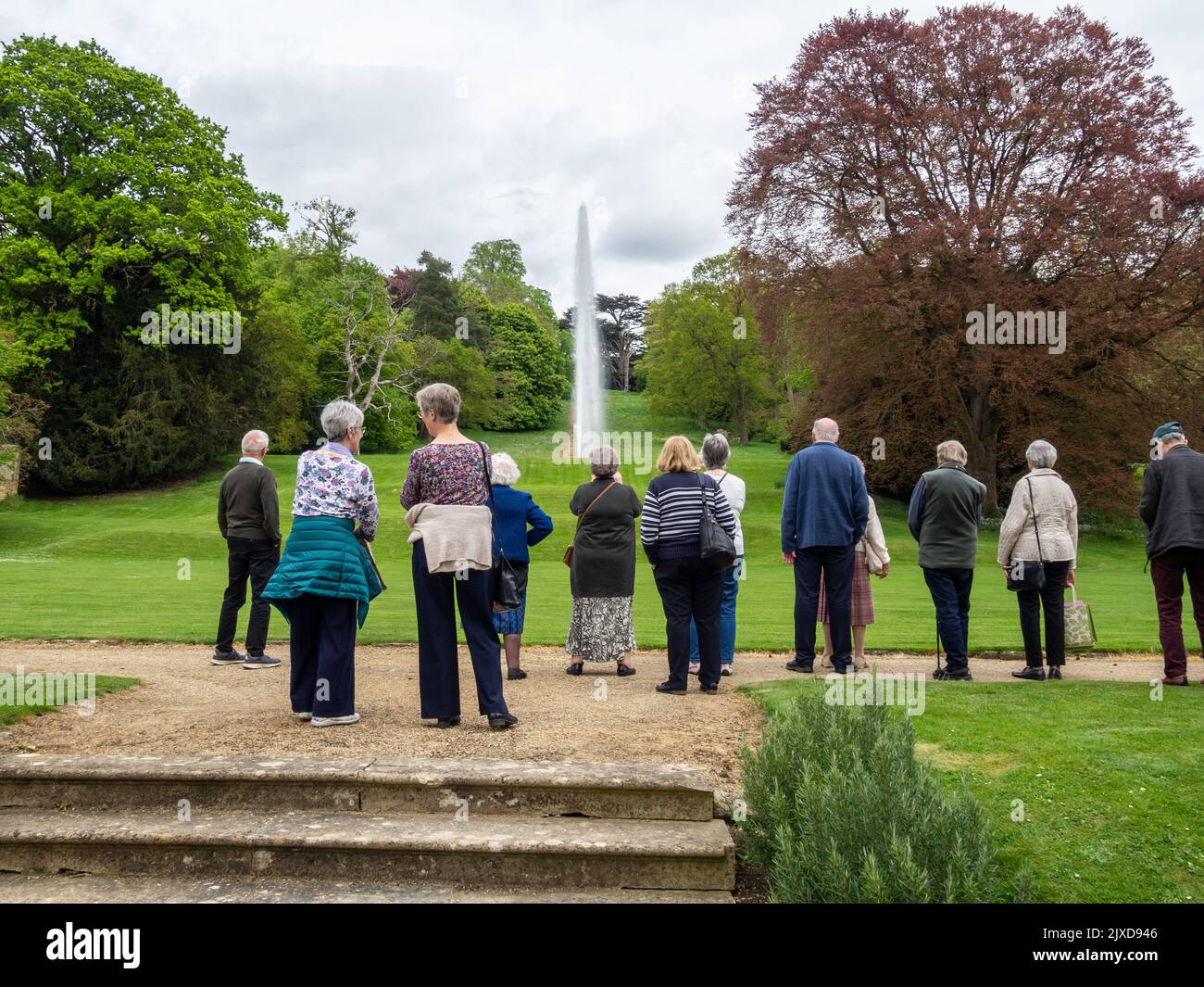 Visitors to Stanway House view the fountain, the tallest gravity fed one in the world, Stanway, Gloucestershire, UK Stock Photo