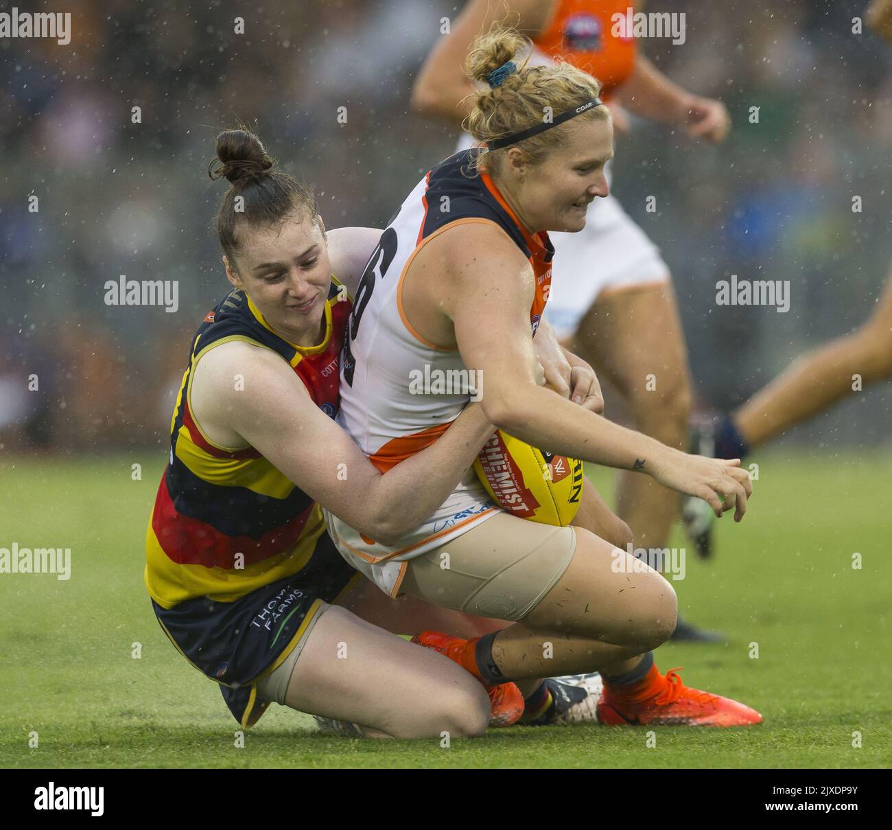 Sarah Allan of the Crows tackles Britt Tully of the Giants during the