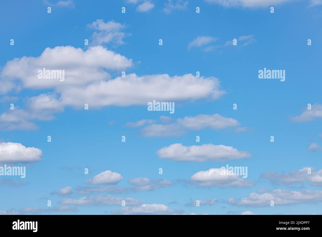 Blue sky and fluffy clouds over Cornwall. Metaphor summertime, summer vacation, summer holidays UK, cloud cover, cloud computing, cloud silver lining Stock Photo