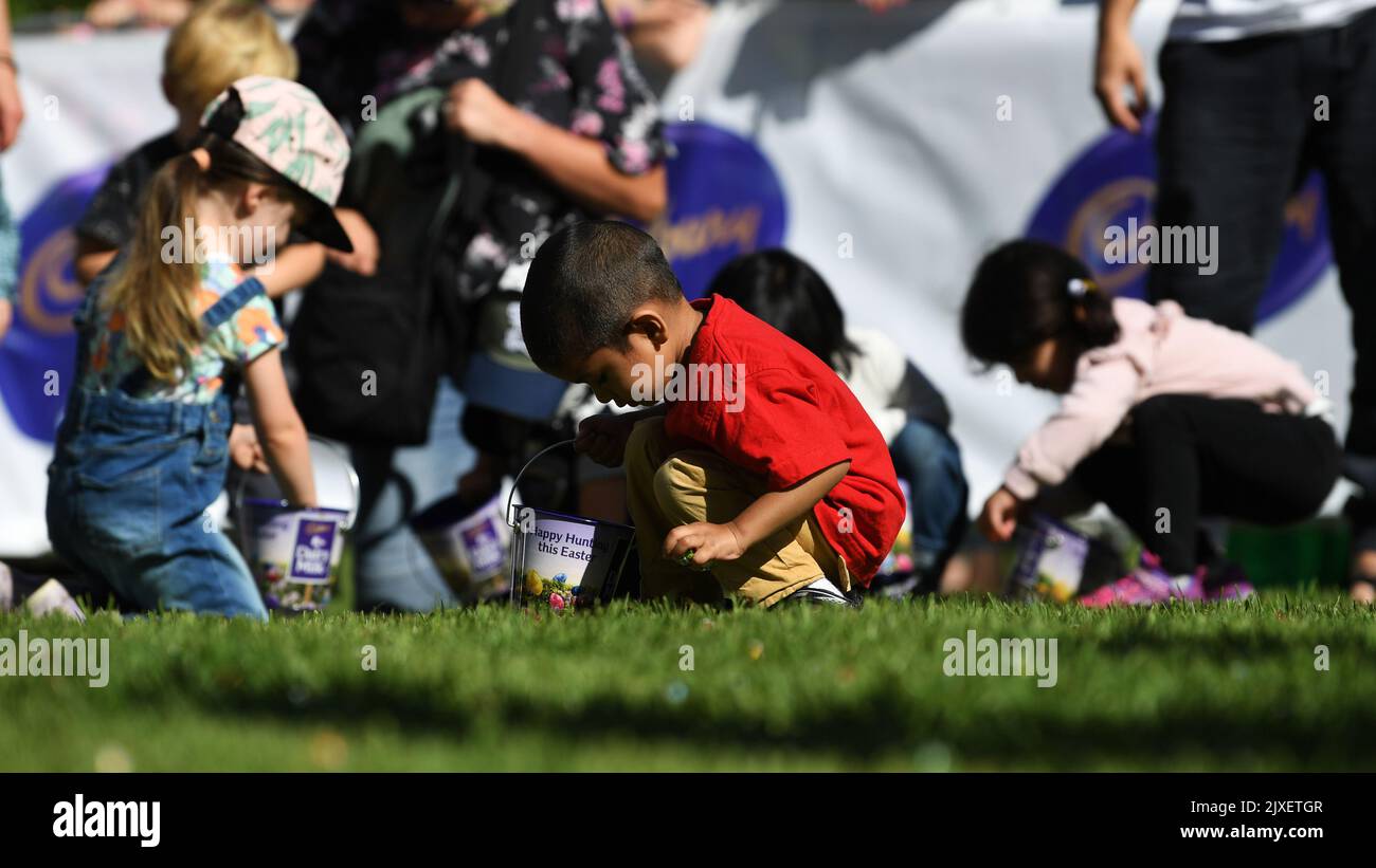 Children collect chocolate eggs during the annual Cadbury Easter Egg