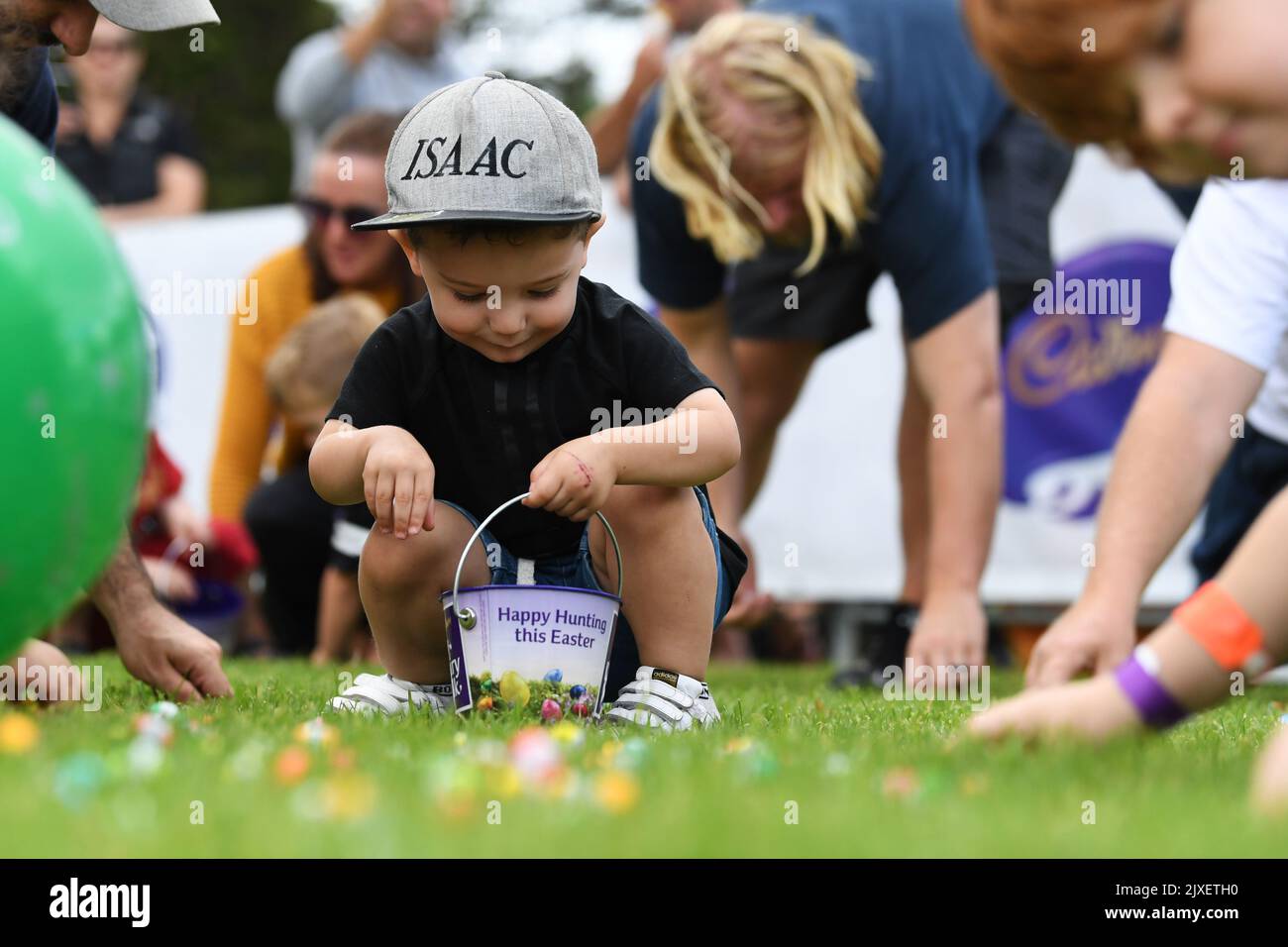 Children collect chocolate eggs during the annual Cadbury Easter Egg