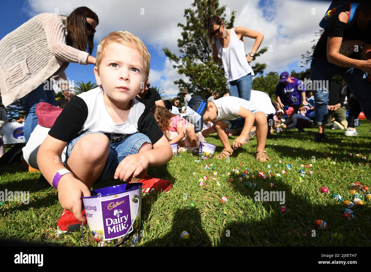 Children collect chocolate eggs during the annual Cadbury Easter Egg