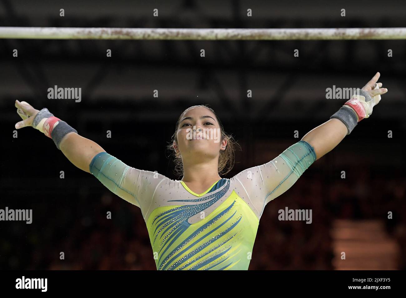 Godwin of Australia finishes her routine on the uneven bars in