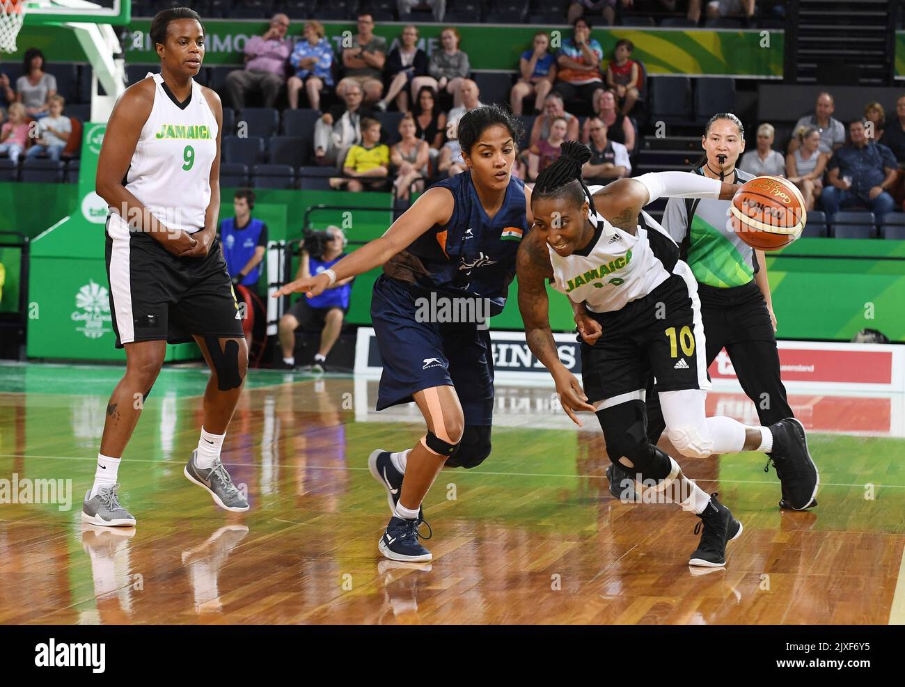 Jamaica's Shenneika Smith (right) powers past India's Grima Merlin