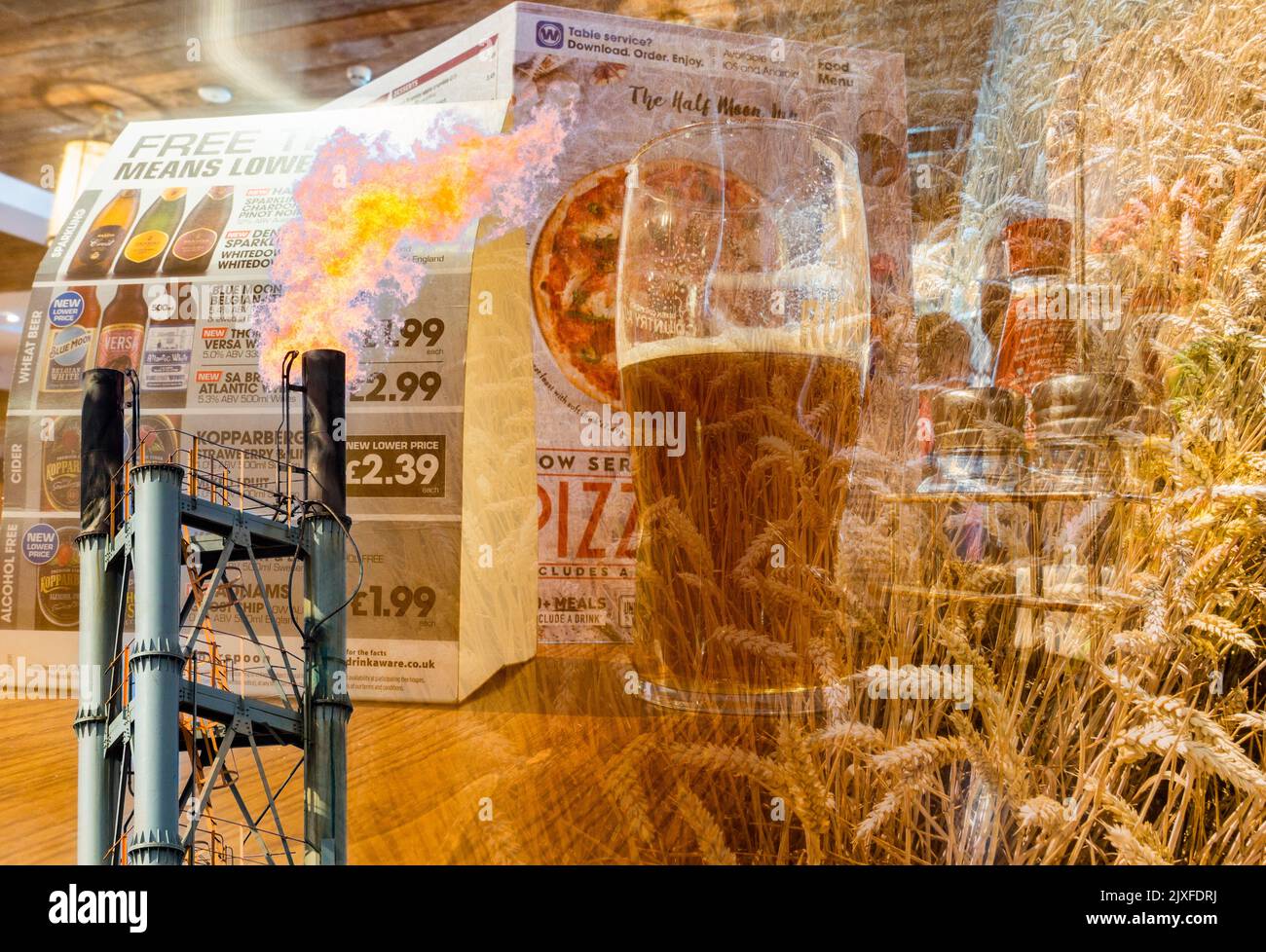 Pint of beer in UK pub with gas and wheat/Barley image overlayed. Rising gas, energy, food prices, fuel poverty, pubs, cost of living, inflation... UK Stock Photo