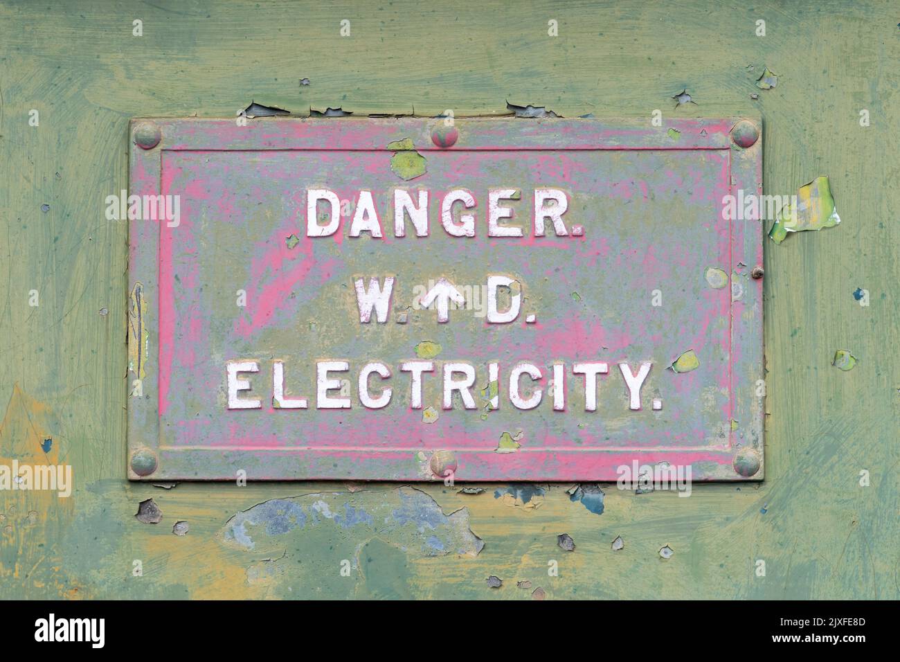 Od war department sign marked W arrow D on electricity box, from world war II, Woolmer Forest MOD site in Hampshire, England, UK Stock Photo