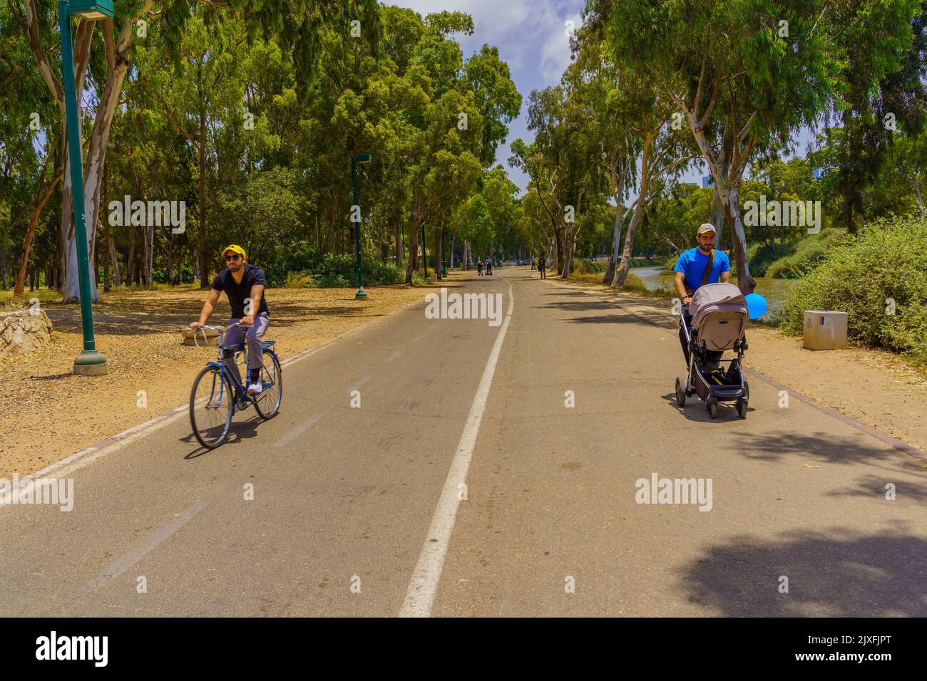 Tel-Aviv, Israel - June 17, 2022: Scene of the Yarkon Park with visitors walking and cycling, Tel-Aviv, Israel Stock Photo