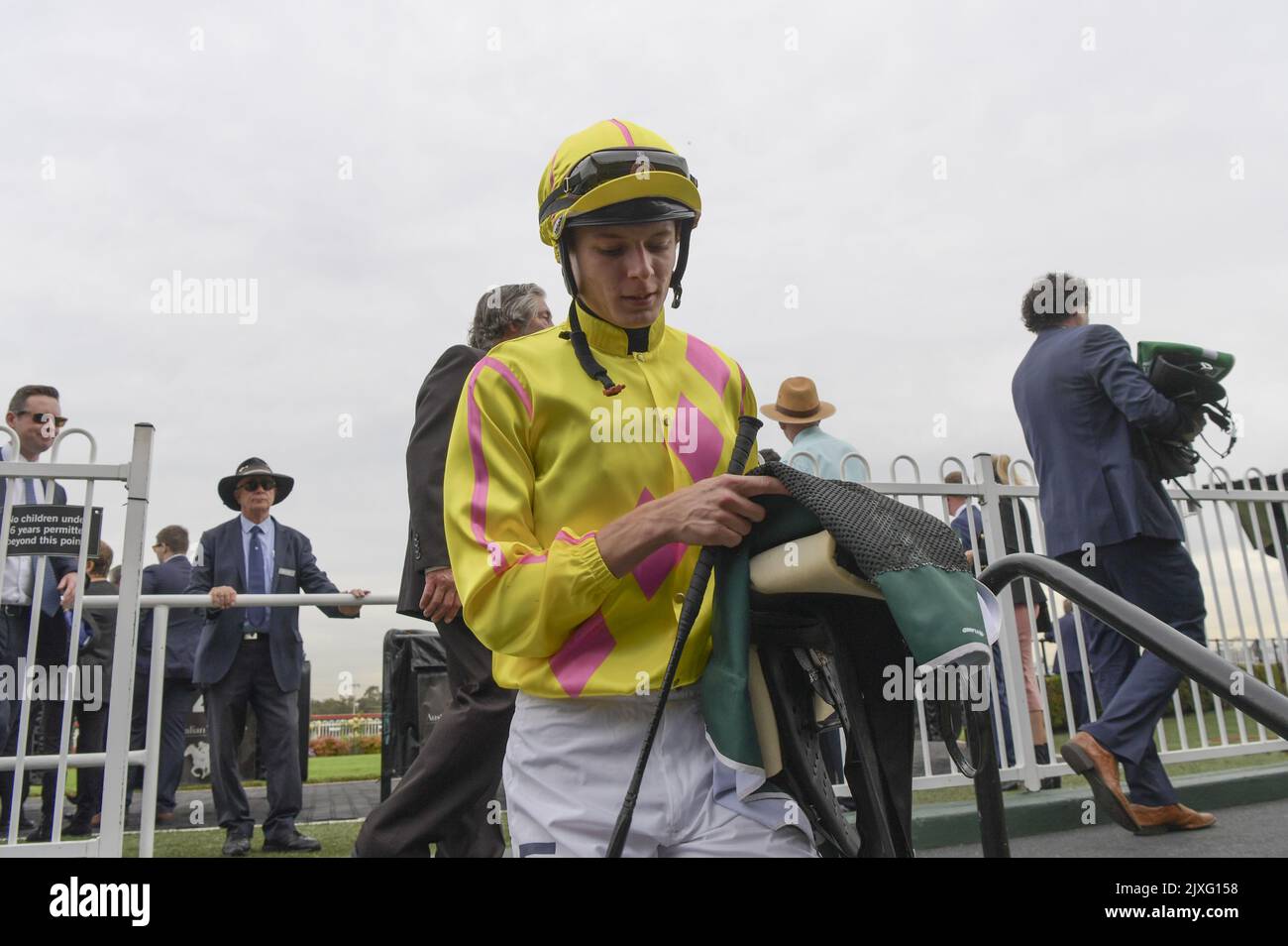 Jockey Koby Jennings returns to scale after riding Dawn Dawn to victory in Race 3, the Pluck