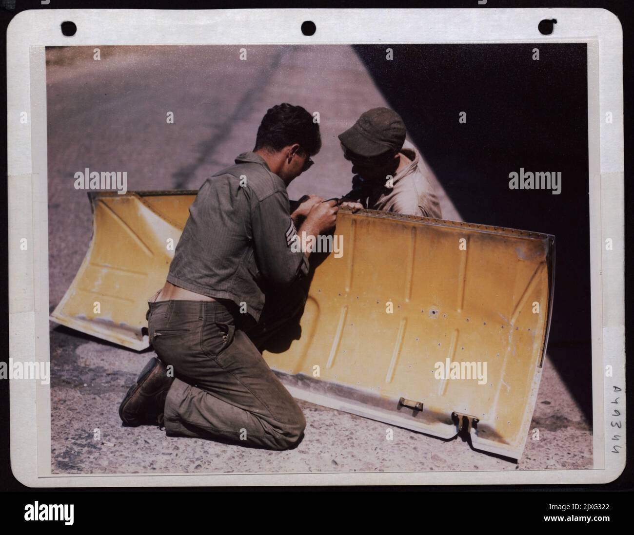 Engineers Rivet Piece Of Sheet Metal With Riveting Gun Stock Photo Alamy