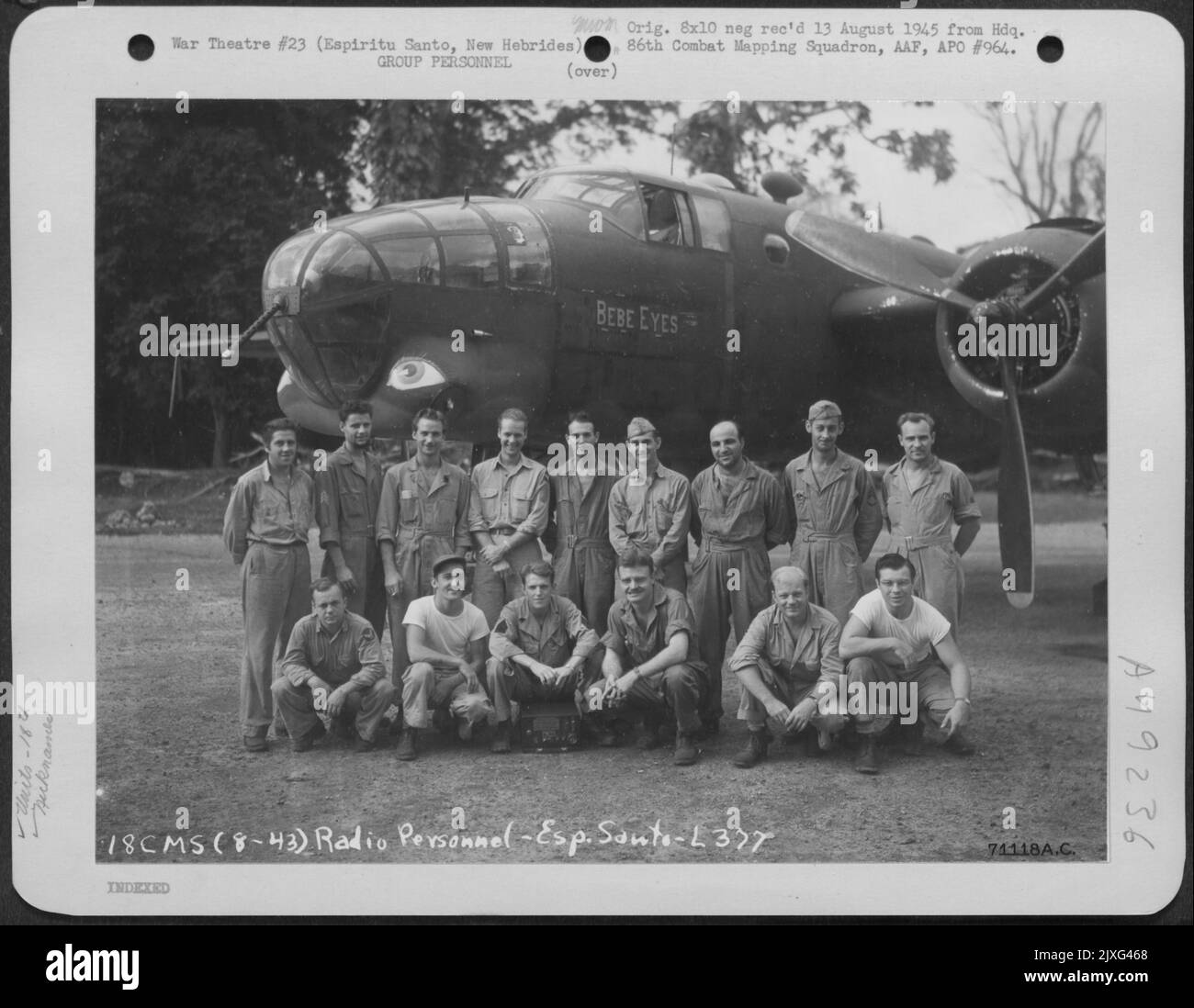 Radio Personnel Of The 18Th Combat Mapping Squadron, Pose Beside The