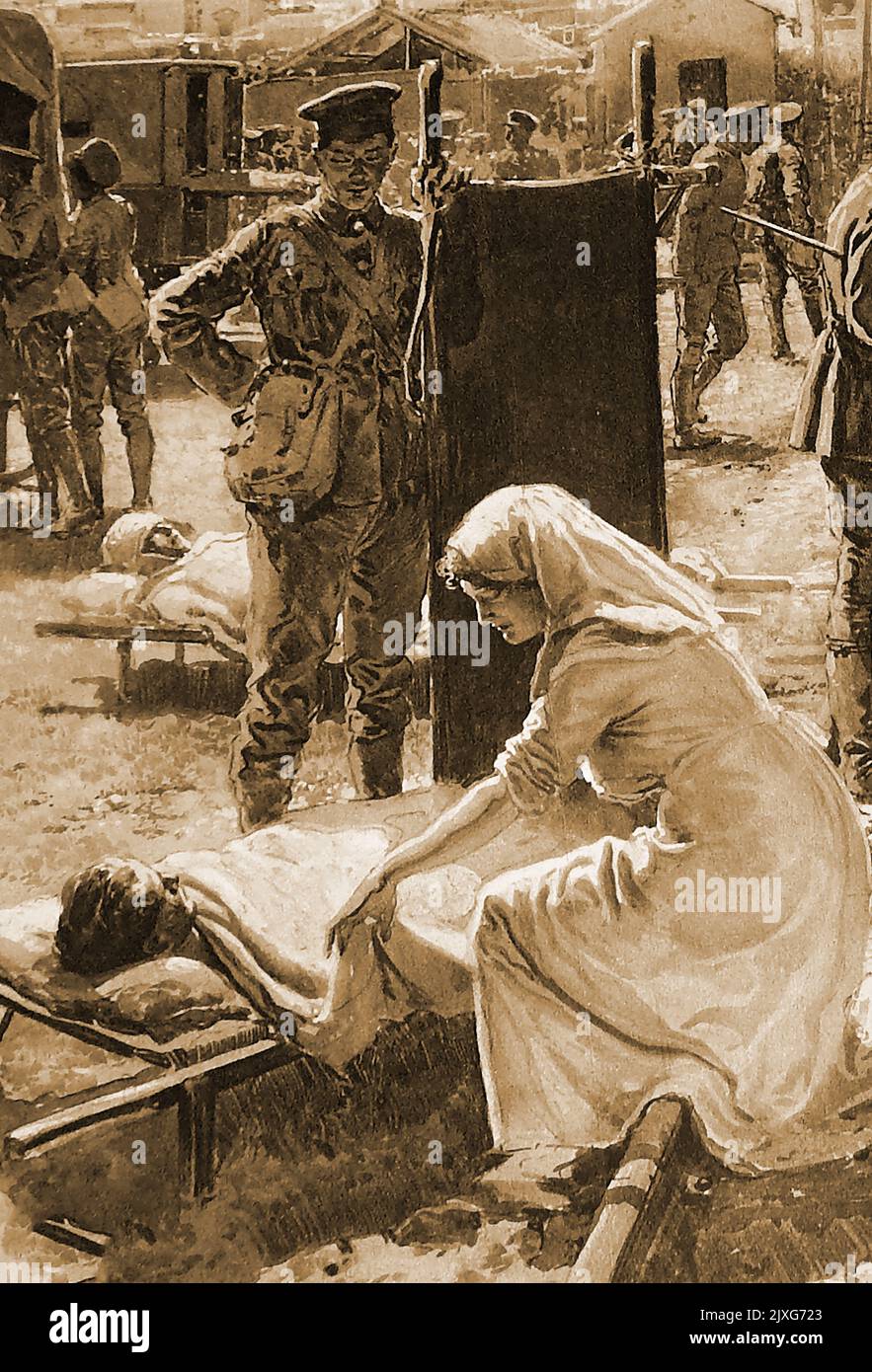 WWI France -  A British nurse attends to a wounded soldier on a stretcher, whilst a stretcher bearer watches on. Stock Photo