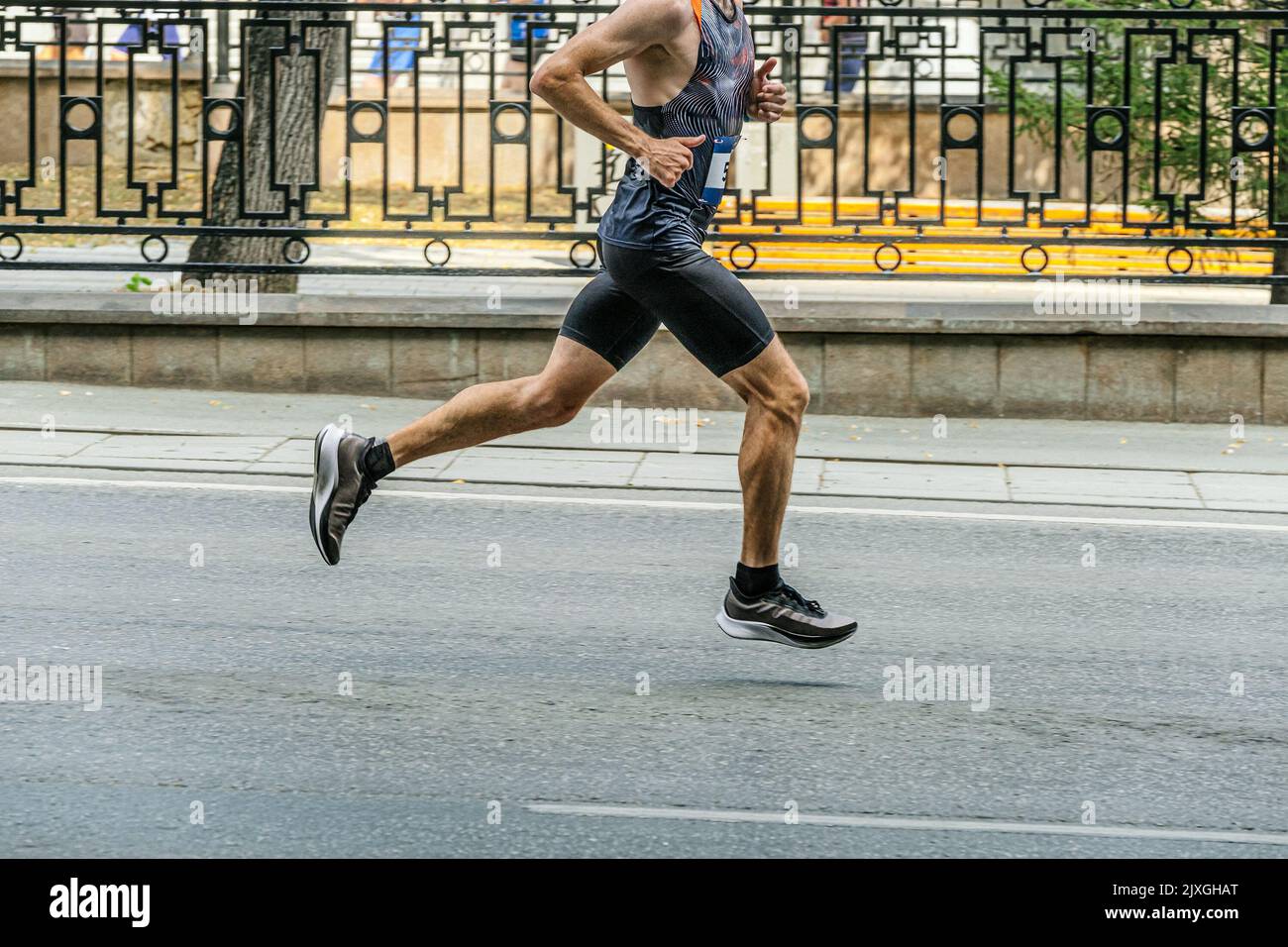 athletic male runner running marathon race Stock Photo