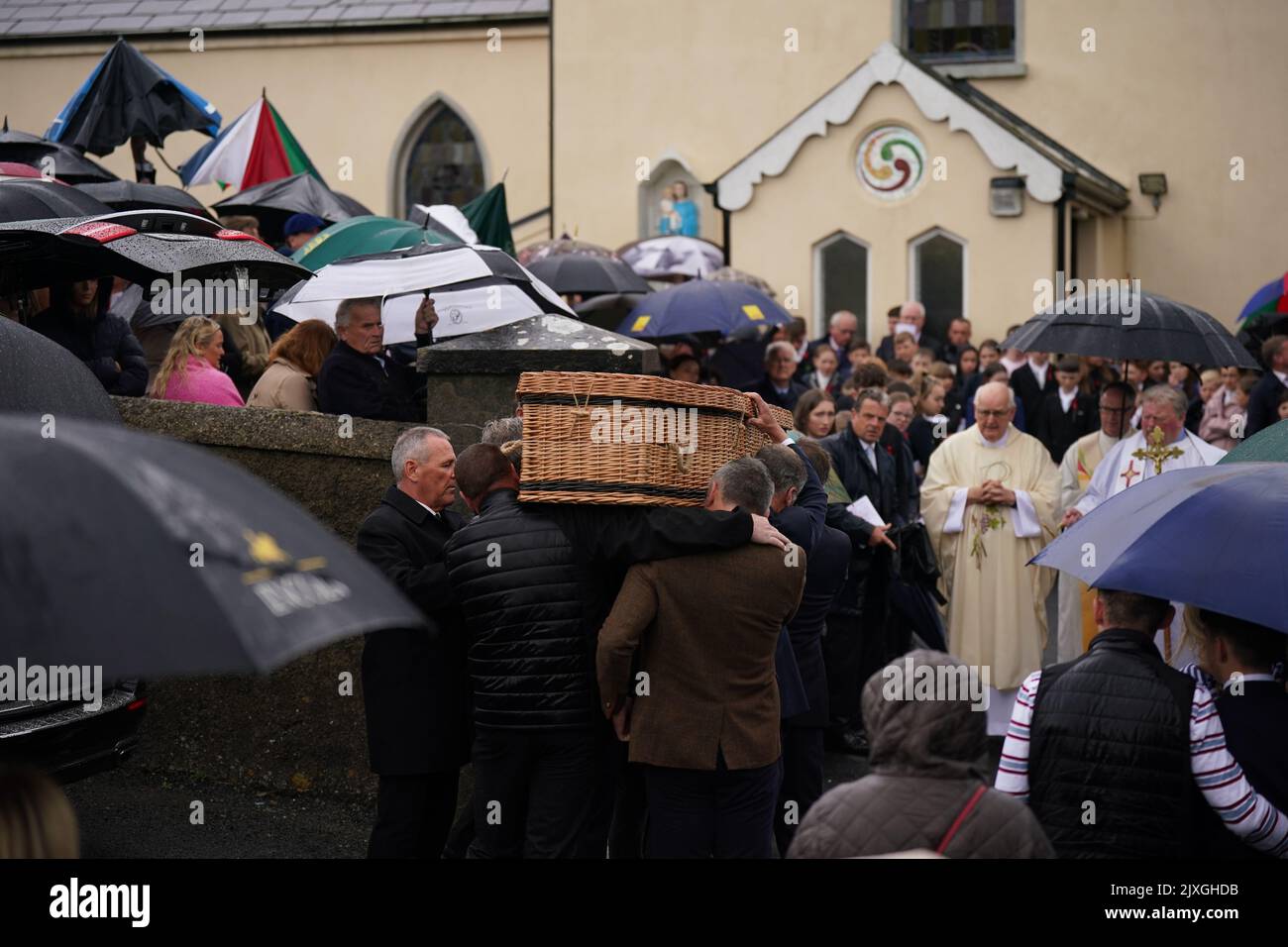 The coffin of Jack de Bromhead being carried into The Church of the